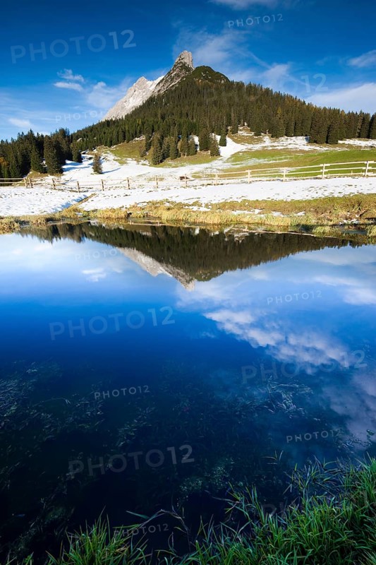 Walderkamp peak and Hundskopf reflected in a small lake