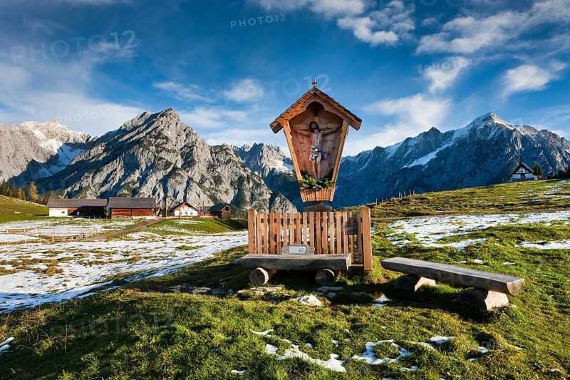 Way-side cross in front of Walder Alm and Karwendel Mountains