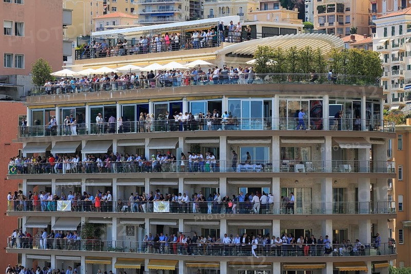 Spectators on balconies in a high-rise building at the Formula 1 Grand Prix Monaco 2015
