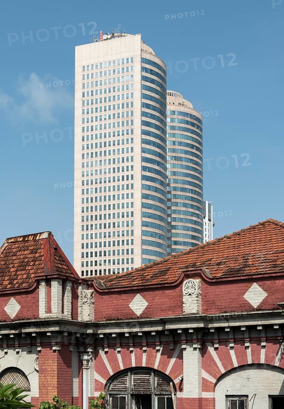 Towers of World Trade Center and abandoned colonial house