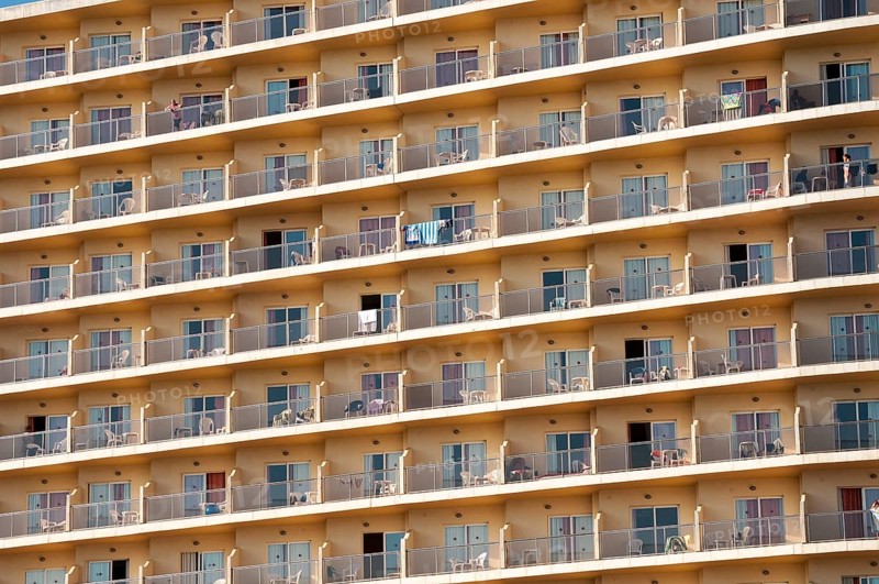 Rows of balconies on the facade of a large hotel complex in Torremolinos