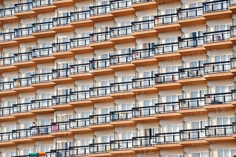 Rows of balconies on the facade of a large hotel complex in Torremolinos