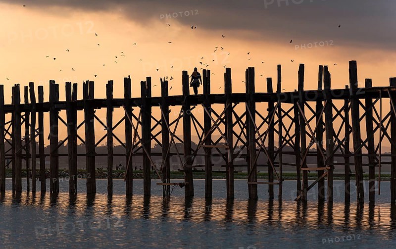 Sunrise over the U Bein Bridge crossing the Taungthaman Lake