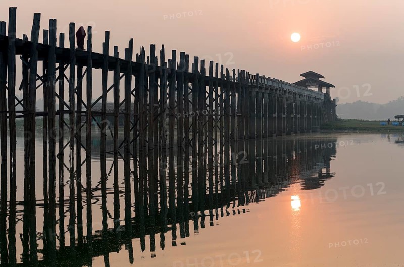 Sunrise over the U Bein Bridge crossing the Taungthaman Lake