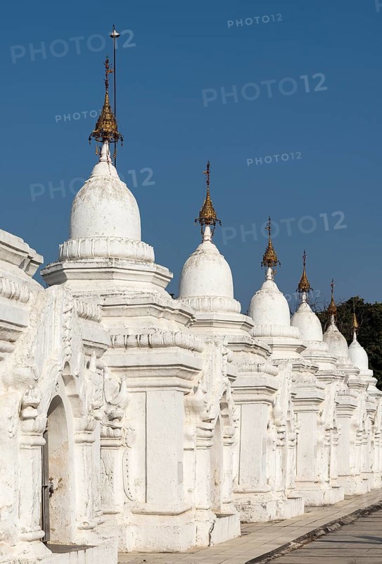 Row of whitewashed stone-inscription caves at Kuthodaw Pagoda