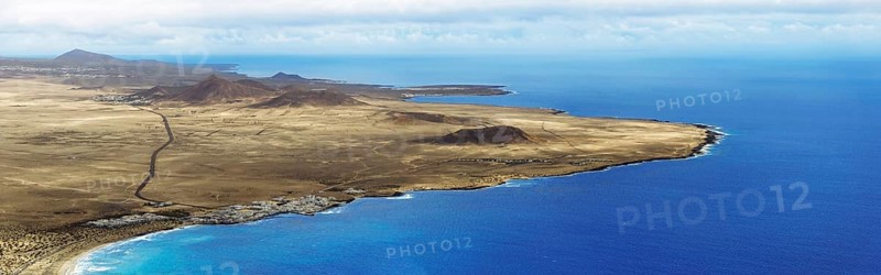 View from Mirador de El Risco de Famara to village Caleta de Famara