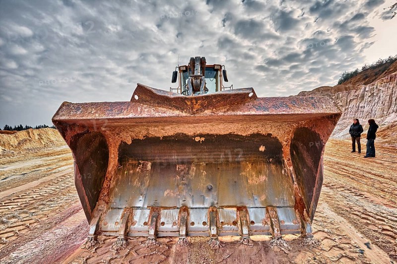 Shovel excavator in kaolin pit