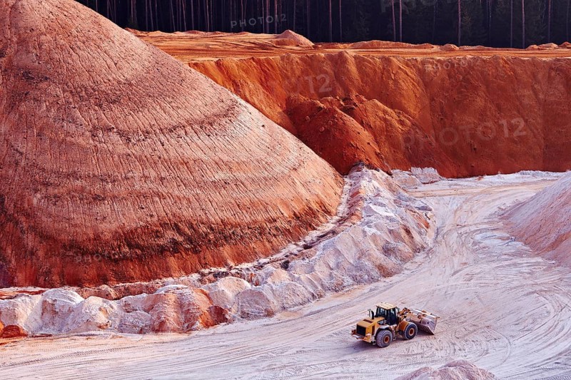 Excavator in kaolin pit