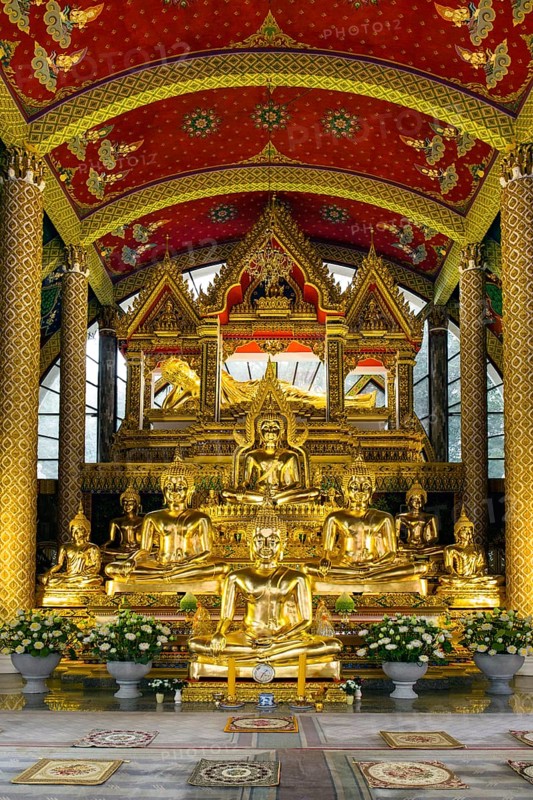 Golden Buddha statues in the temple district Wat Phra That Nong Bua