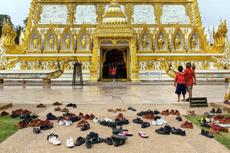 Shoes in front of Wat Phra That Nong Bua