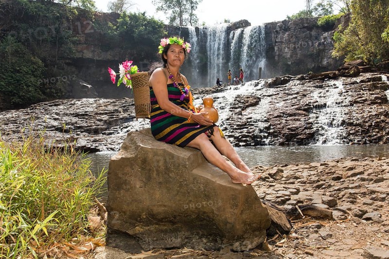 Phnong woman posing for tourists at the Bousra waterfall
