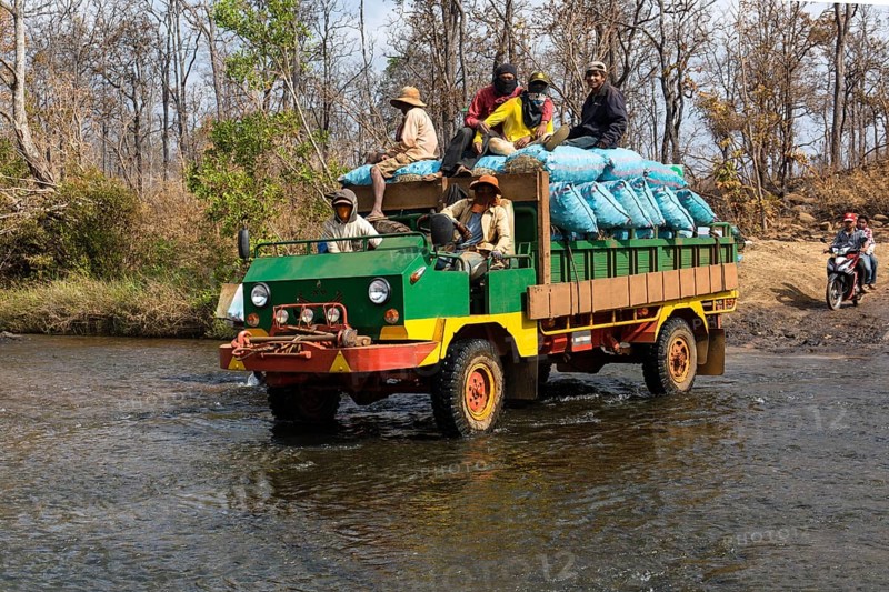 Truck crossing the river at the Bousra waterfall