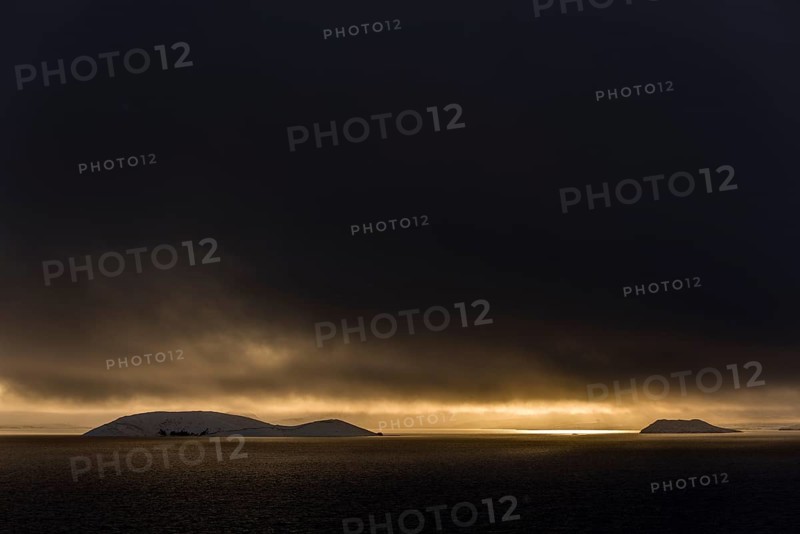 Sunset over Lake Pingvallavatn with mountaineous landscape