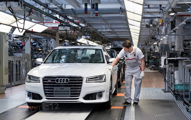 Audi AG employee conducting the first run of an assembled A8 sedan