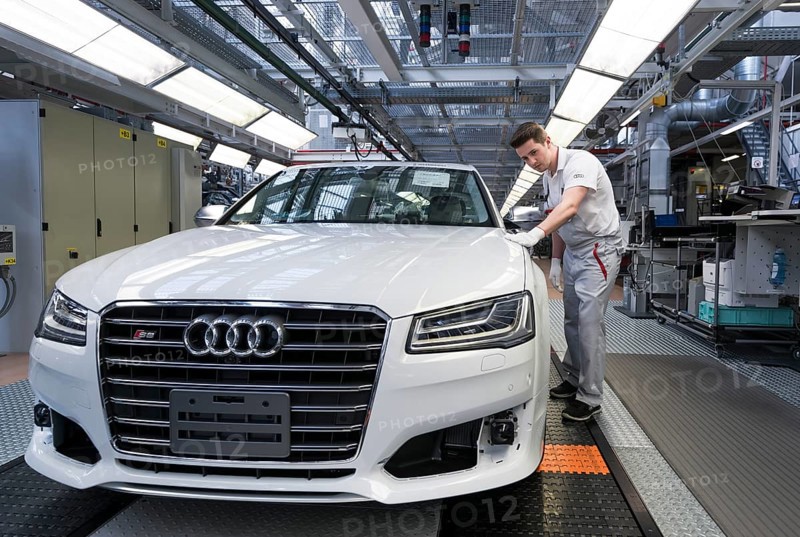 Audi AG employee conducting the first run of an assembled A8 sedan