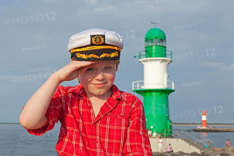 Young boy with a captain's hat