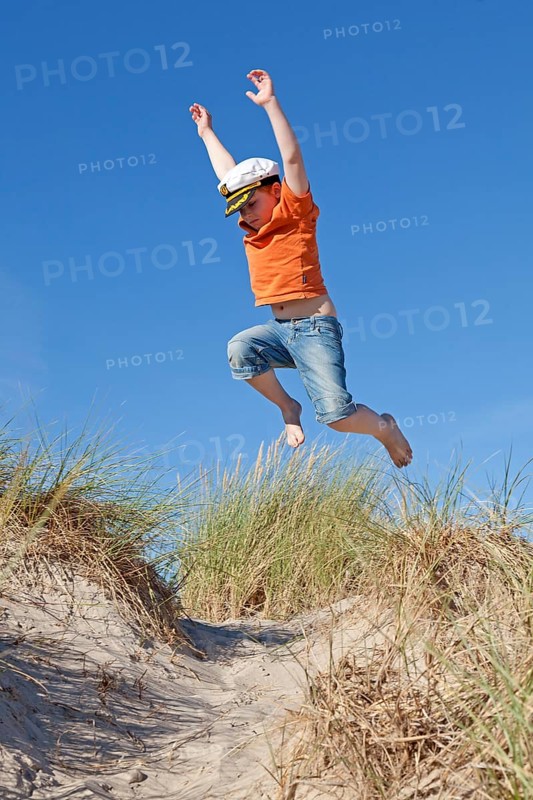 Boy wearing captain's hat