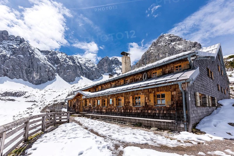 Coburg Hut on lake Drachensee with Grunsteinscharte and Drachenkopf mountains