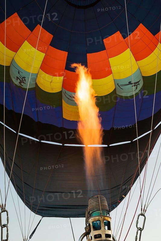 Pilot inflating hot air balloon with two burners