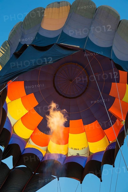 Pilot inflating hot air balloon with two burners