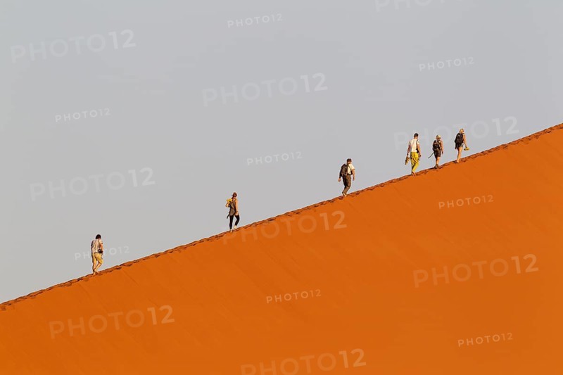Tourists climbing Dune 45 in the Namib Desert