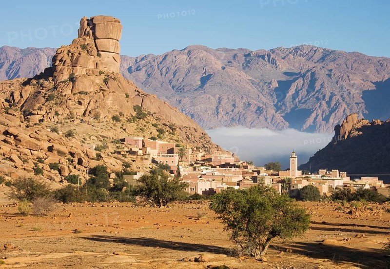 The village of Aguard Oudad at the foot of the famous rock formation Chapeau de Napoleon