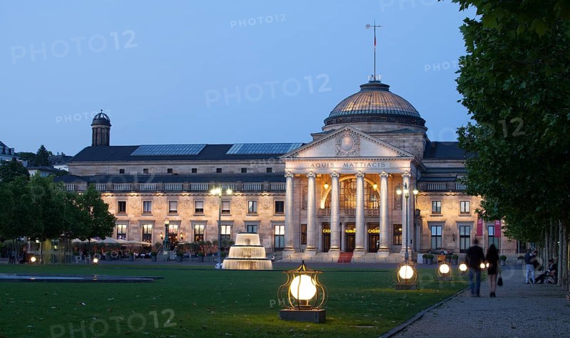 Spa hotel with fountain and park Bowling Green at dusk