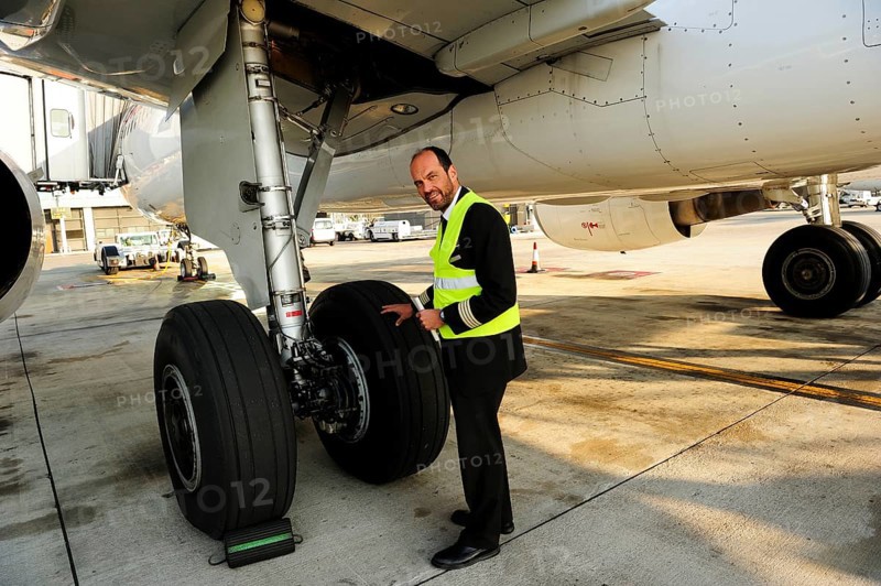 Pilot checking tyres and undercarriage