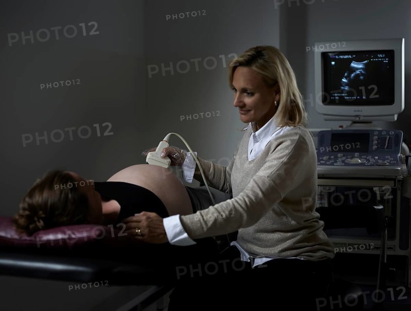 Gynaecologist examining pregnant woman