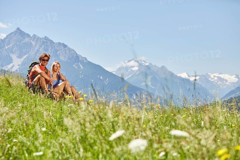 Man and woman sitting in a meadow