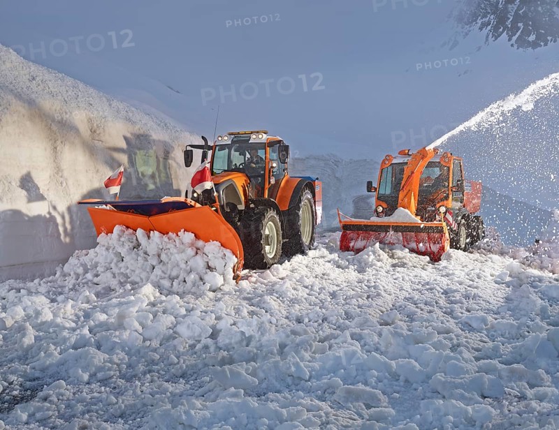 Snowplow and tractor removing snow
