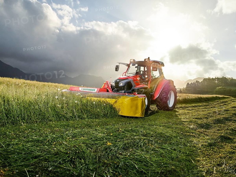 Tractor mowing a field