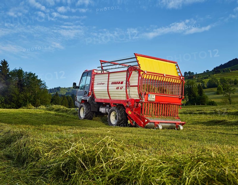 Unitrac transporter with forage trailer collecting the dried hay