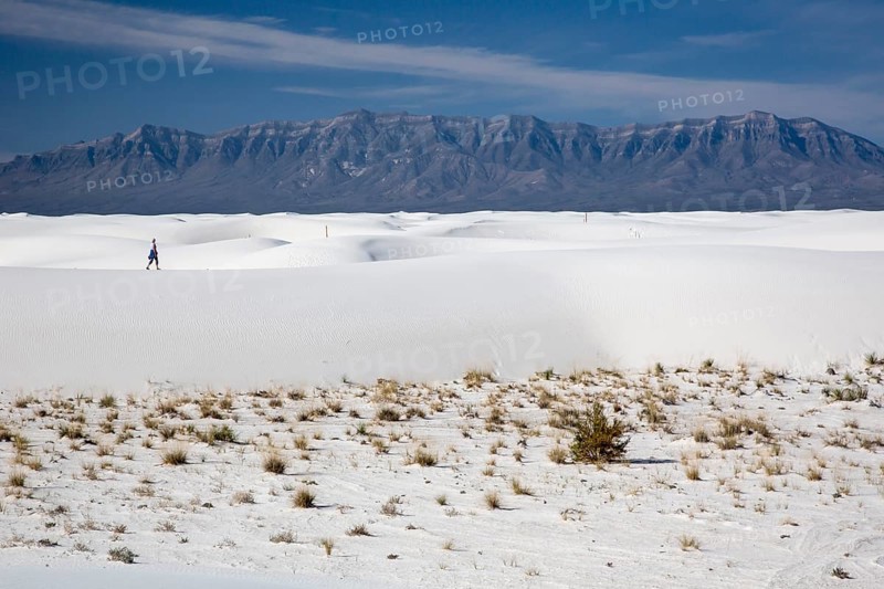 A woman hiking in White Sands National Monument
