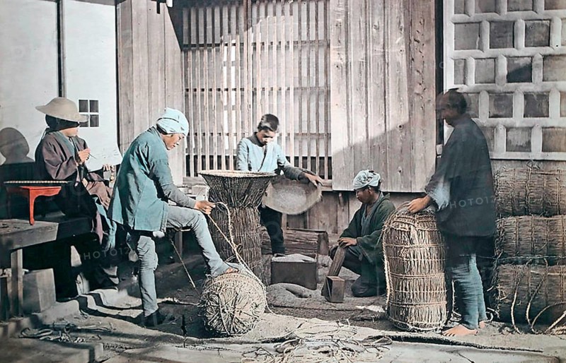 Farmers producing rice bundles