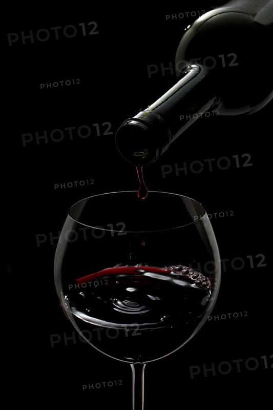 Red wine being poured into a glass