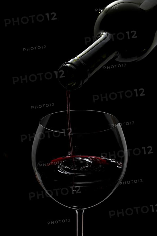Red wine being poured into a glass