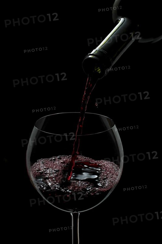 Red wine being poured into a glass