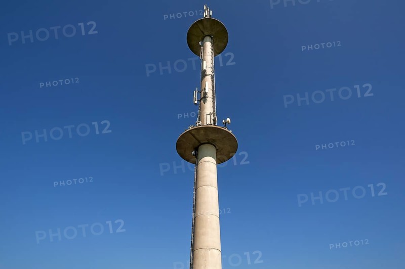 Transmission tower against blue sky