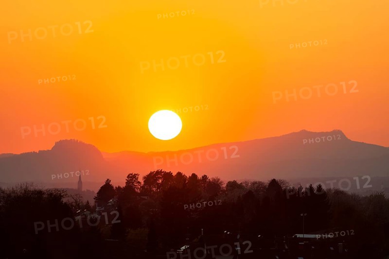 Sunset between the Hohentwiel and Hohenstoffeln mountains in the Hegau