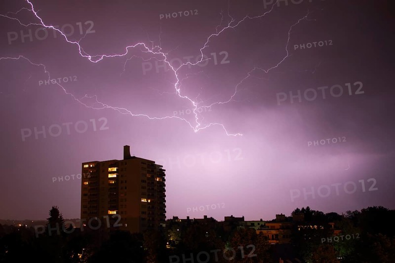 Lightning at night at a high-rise building