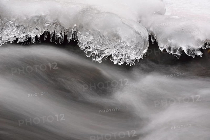 Ice formations on a rock in the Selke River