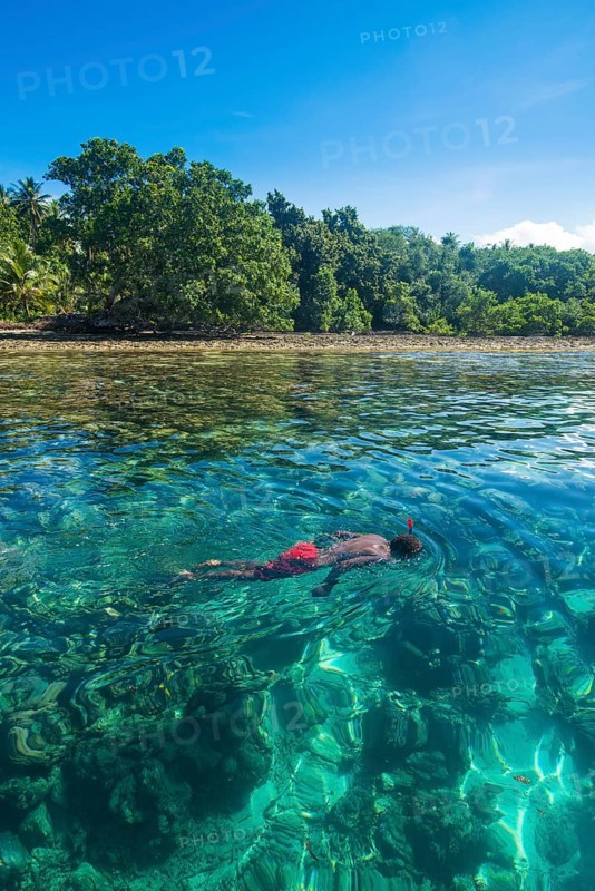 Man snorkeling in the clear waters