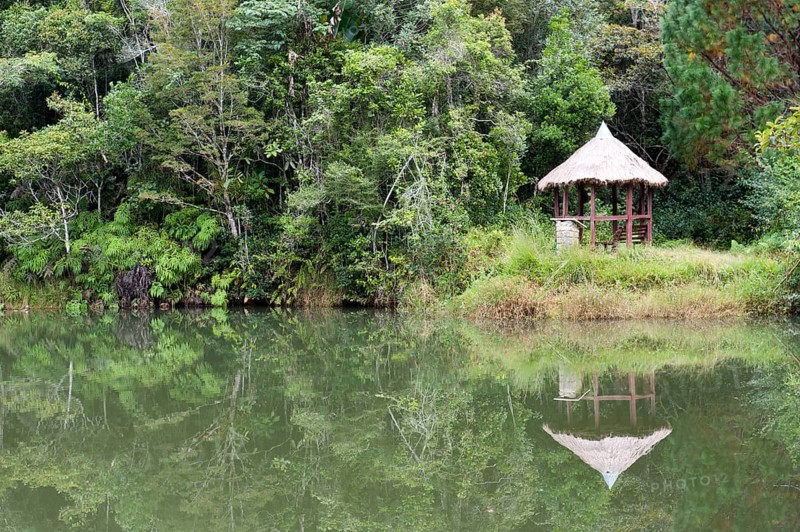Cottage reflected in a lake