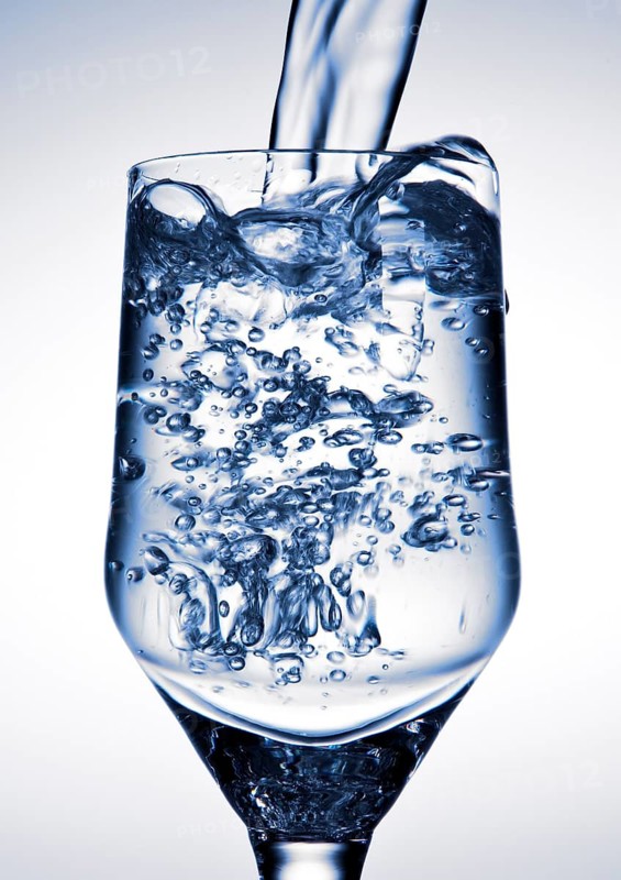 Water is being poured into a glass