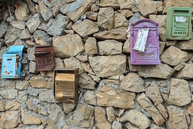 Post boxes on a stone wall