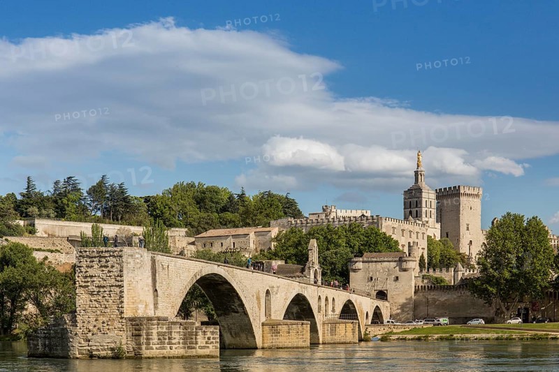 The historic bridge of Avignon with the papal palace in the background