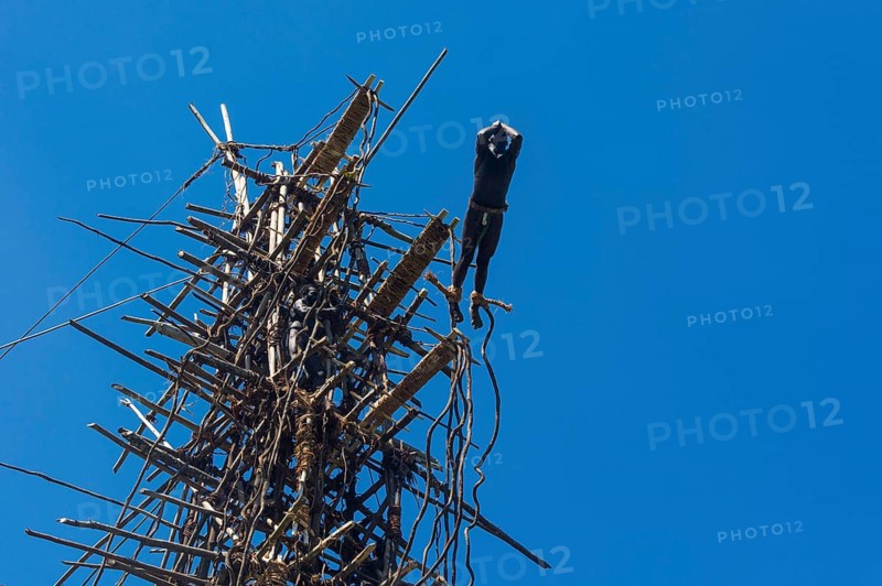 Man jumping from a bamboo tower