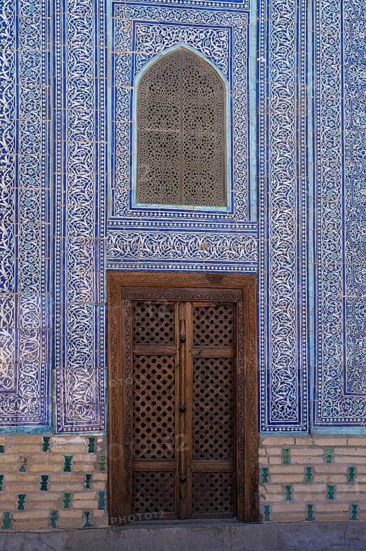 Door and mosaic-decorated wall