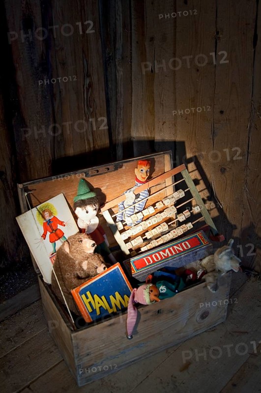 Old toys in a wooden chest